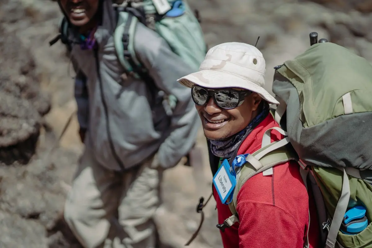 Albert Mwambo, another Kilimanjaro legend, leading a client Albert Mwambo, another Kilimanjaro legend, leading a client