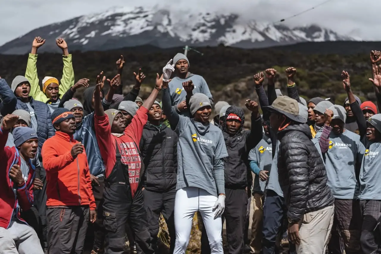 Porters often dance and sing to greet arriving clients Porters often dance and sing to greet arriving clients